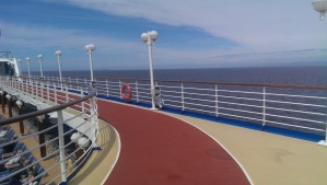 Walking track on the top deck of a Princess cruise ship during a sunny day at sea